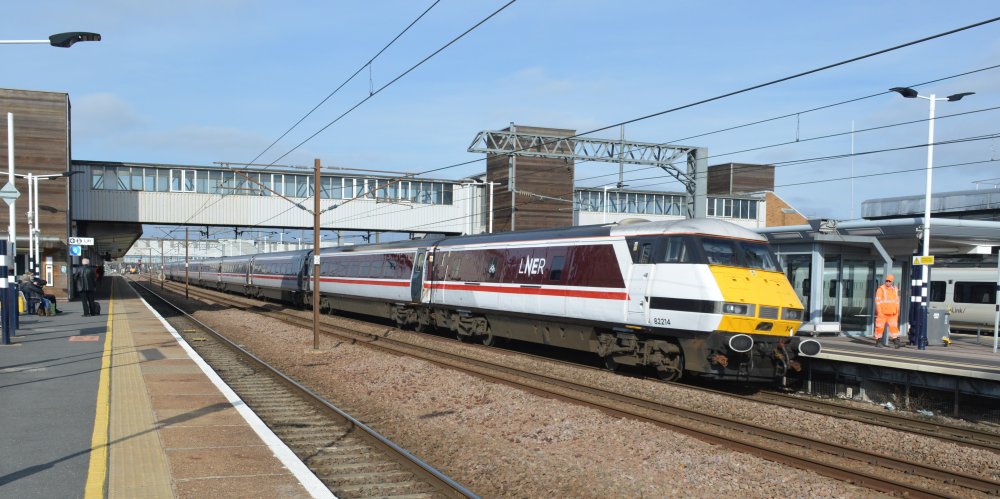 Rear DVT 82214 of a Class 91 electric locomotive hauled  LNER service from Kings Cross, London to Leeds
		, heading north through Peterborough station (February 2023).