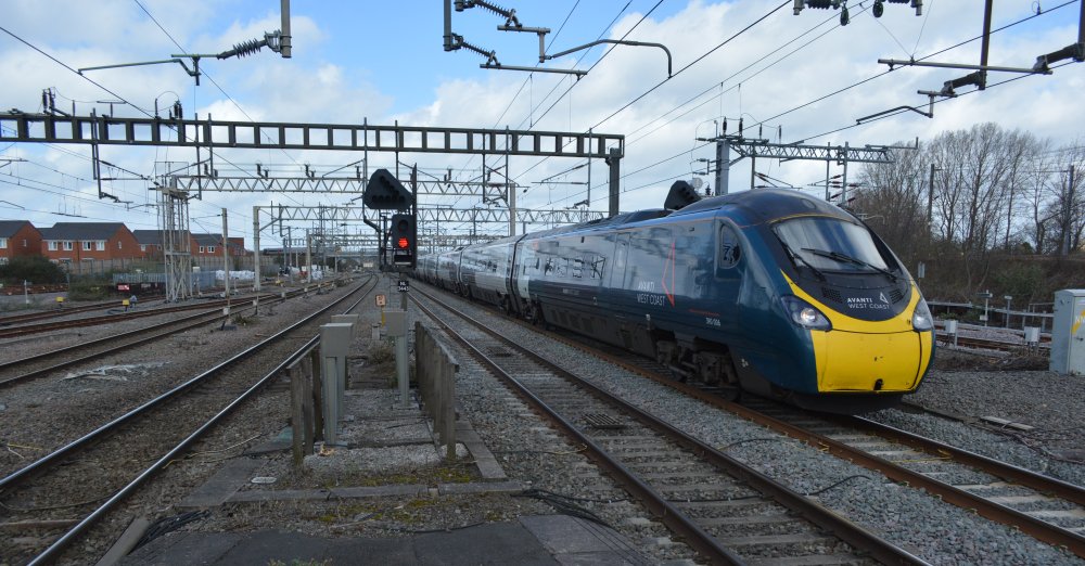 trainspotting Class 390 express EMU unit 390006 stopping at Nuneaton station with an Avanti West Coast train service from Manchester Piccadilly to London Euston station